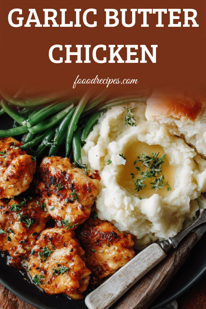 Garlic Butter Chicken Bites Dinner served with mashed potatoes, green beans, and dinner roll on a black