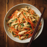 Classic Chinese Chicken Lo Mein in bowl with chopsticks
