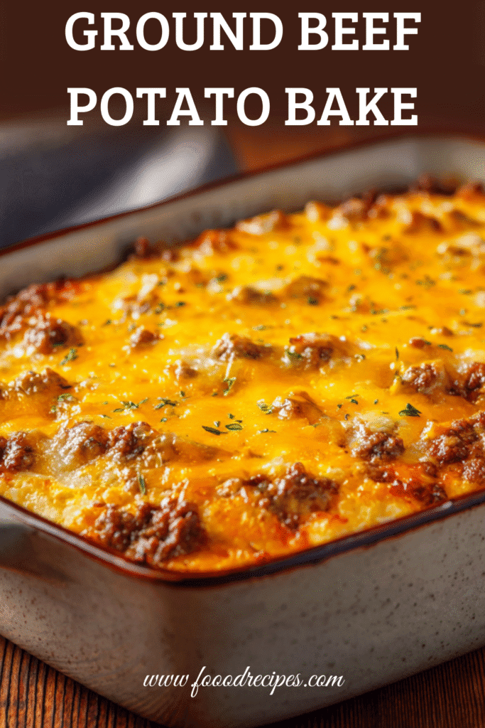 One-dish ground beef casserole topped with melted cheese in a rustic baking dish