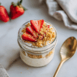 Vanilla Cheesecake Protein Overnight Oats in a mason jar